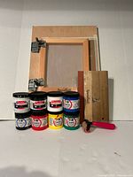 Lot overview showing silkscreen frame, eight ink jars, squeegee and brayer