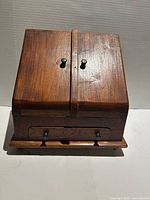 Cabinet closed showing wood finish and hardware