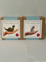 Front view of two unopened felt craft kits