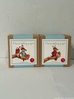 Front view of both unopened Corinne Lapierre Charlotte Fox and Felix Fox felt craft kits