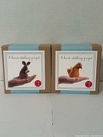 Front view of both sealed Threadfollower felt animal sewing kits