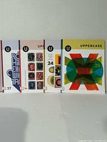 Front view of four Uppercase magazines standing side by side