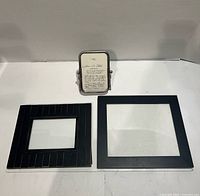 All three frames displayed: two black square wood frames and one silver-tone metal frame