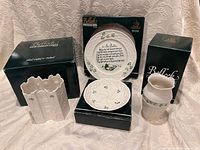group shot of four Belleek pieces with their boxes