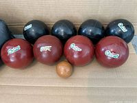 Front view of eight bocce balls and pallino