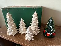 All five Christmas tree figurines together