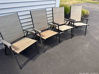 All four folding patio chairs lined up