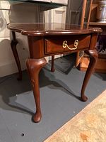 Full view of Harden cherry end table showing drawer and legs