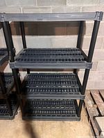 Front view of single 4-tier plastic shelving unit