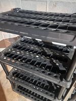 Close view of ventilated plastic shelves and support posts