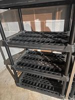 Full view of shelving unit showing four ventilated shelves