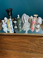 Overview of all miniature vases on mirrored tray