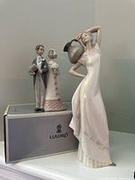 Both figurines displayed on Lladro box