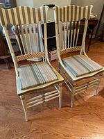 Front view of both painted bentwood chairs