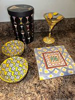 Lot overview showing trivet, martini glass with box, two bowls