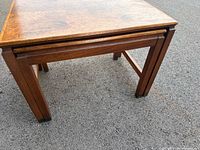 Largest table with smaller nested beneath showing leg structure