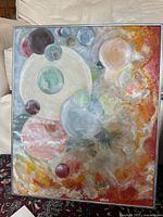 Full view of painting showing circular motifs and frame