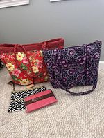 Group shot: both tote bags, zip pouch and clutch