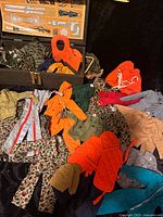 Overview of trunk, assorted GI Joe scale garments laid out