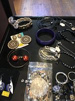 Overview showing bracelets, earrings, keyring charms, jump rings pack