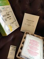 Retail box, paperwork, lamp still bagged in tray