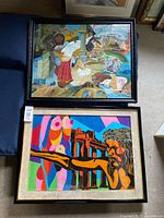Both framed paintings side by side