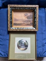 Both framed watercolours displayed together