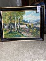 Full view of framed landscape painting