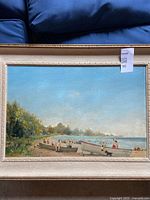 Full view of framed oil painting showing beach scene