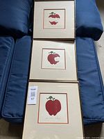 All three framed serigraph prints stacked showing apple images and frames