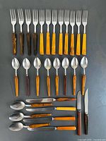 All 29 pieces laid out showing handles and utensil ends
