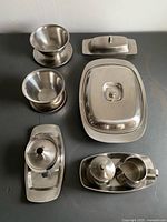 All seven stainless steel pieces arranged together