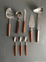 All eight utensils laid out for overview