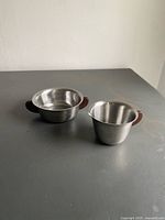 Sugar bowl and creamer together on tabletop