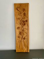 Front view showing full carved floral design