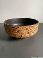 Angled side view of planter showing bark texture and interior glaze