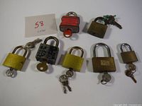 All seven padlocks arranged together with keys showing