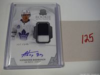 Front of card showing autograph, patch, serial number