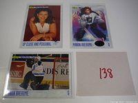 Fronts of all three Manon Rheaume cards in sleeves