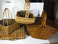 All four wicker baskets grouped to show variety and size