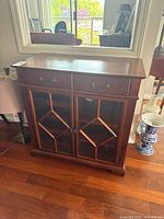 Front view showing drawers and glass doors