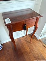 Front view of Bombay side table with drawer closed