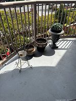 All planters and stand grouped on balcony