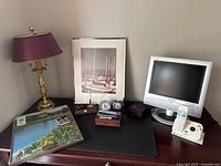 Group overview showing lamp, two pictures, monitor, phone, shredder