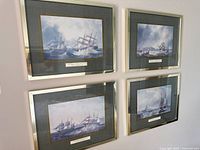 All four framed prints on wall