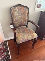 Full view of armchair showing wood frame, upholstery and overall condition