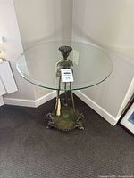 Full view of glass top side table in corner