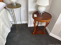 Both side tables beside bed for scale