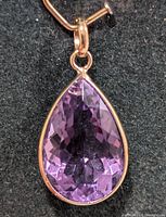 Front view of pear-shaped amethyst pendant in 10K gold