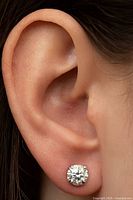 Stud earring worn in ear